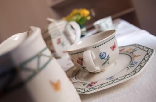 a tea cup and saucer on a table at Campo Marzio Charming B&B in Rome