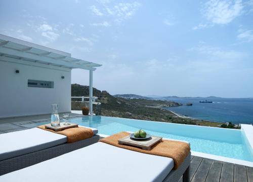 a villa with a view of the ocean at San Marco Hotel and Villas in Houlakia