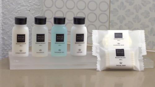 a group of three bottles of moisturizers on a shelf at Country Inn & Suites by Radisson, York, PA in York
