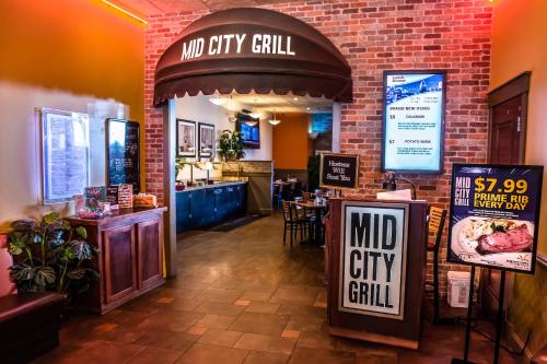 a restaurant with a mmid city grill sign on the wall at Century Casino & Hotel - Central City in Central City