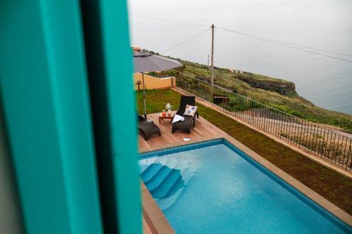 an overhead view of a swimming pool on a balcony at Villa Pargo in Fajã da Ovelha