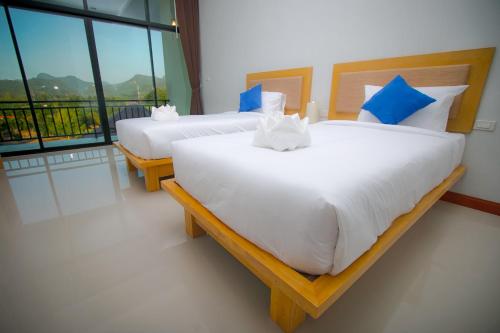 Llit o llits en una habitació de Takhun Mountain View