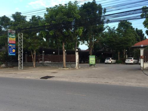 an empty parking lot with two cars parked in it at Pruksa Resort Prachuabkhirikhan in Prachuap Khiri Khan
