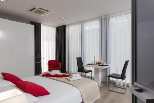 Katil atau katil-katil dalam bilik di Apartments ZoomZoom