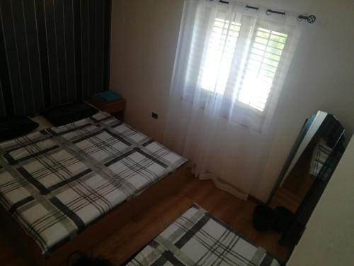 Łóżko lub łóżka w pokoju w obiekcie Apartment Rojnic