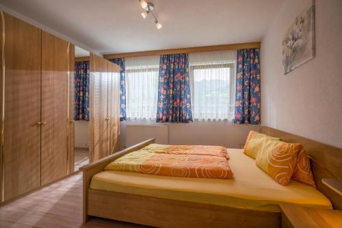 a small bedroom with a bed and a window at Ferienwohnungen Familie Rieder in Kaltenbach