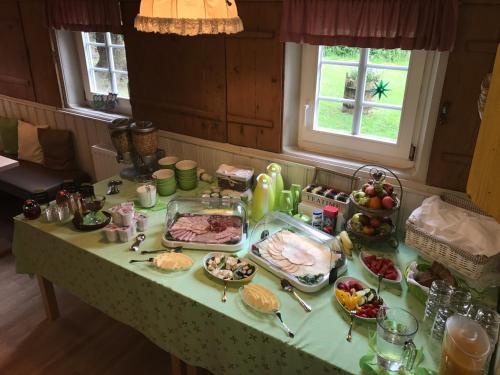 a table with a buffet of food on it at Pension Immergrün in Kurort Jonsdorf