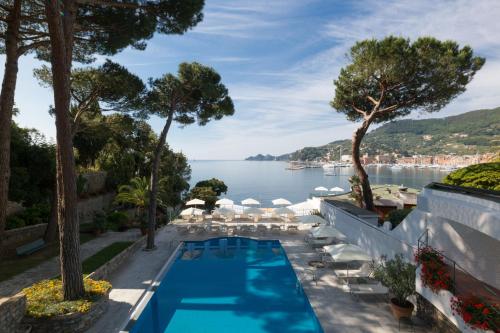 a swimming pool with a view of the water at Imperiale Palace Hotel in Santa Margherita Ligure