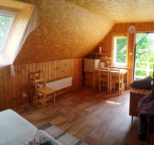 a room with a table and a dining room at Jurna Recreation Farm in Upa