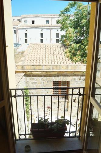 a view of a courtyard from a window at Khalisah in Palermo
