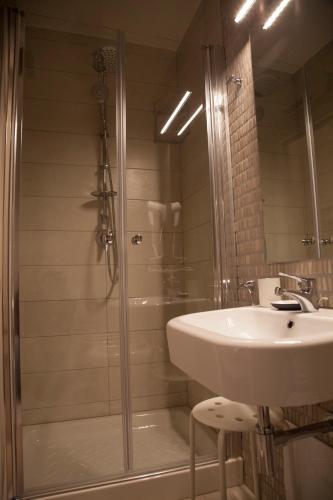 a bathroom with a shower and a sink at SanBiagio, 25 Guesthouse in Naples