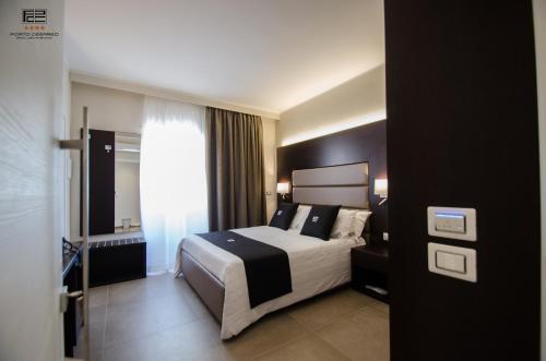Postel nebo postele na pokoji v ubytování Porto Cesareo Exclusive Room