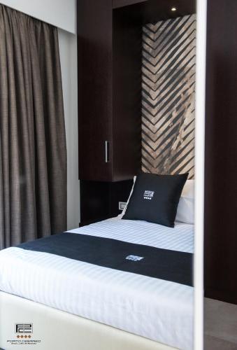 Кровать или кровати в номере Porto Cesareo Exclusive Room
