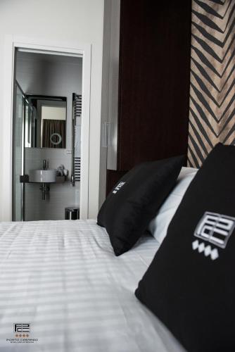 Кровать или кровати в номере Porto Cesareo Exclusive Room