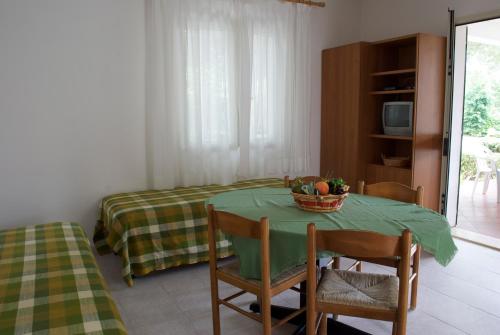 Postel nebo postele na pokoji v ubytování Residence Hotel Baia del Sole