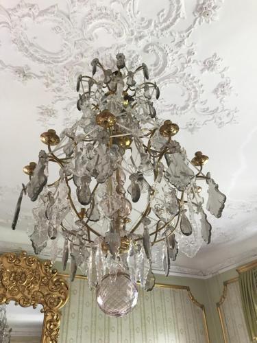 a chandelier hanging from a ceiling in a room at Gamla Stan Simrishamn in Simrishamn