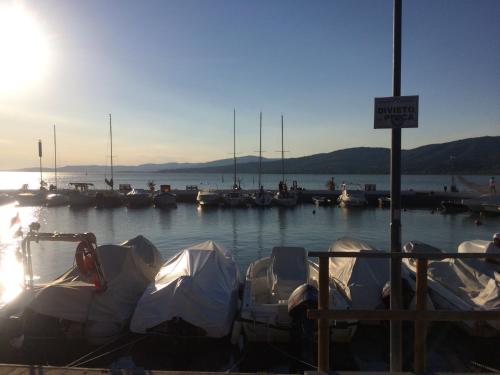 a group of boats docked in a marina at L'Arco B&B di Charme in Passignano sul Trasimeno