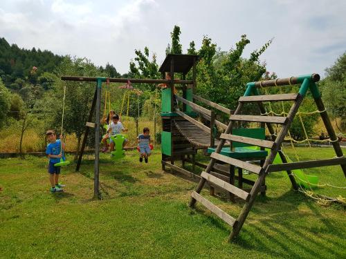 a group of children playing on a playground at Niriides in Porto Koufo