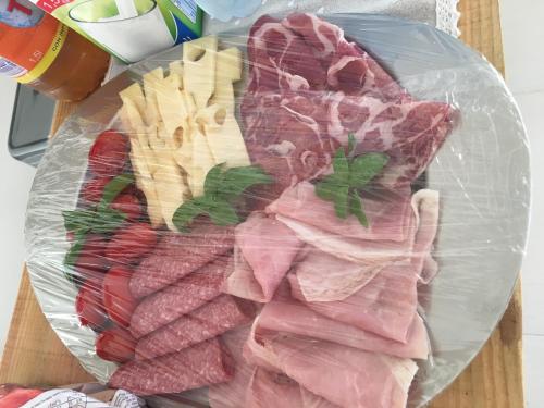 a bunch of different types of meat in a plastic bag at B&B La Via di Casa in San Leone