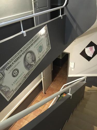 a dollar bill on the stairs of a building at Le Signoret in Sault-de-Vaucluse