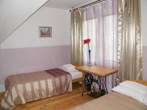 Postel nebo postele na pokoji v ubytování Viesu nams Jūras Bura