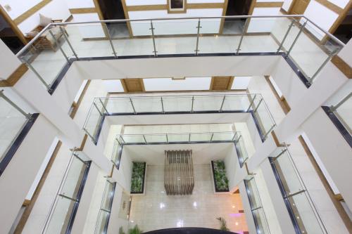 an overhead view of the lobby of a building with glass ceilings at Sidra Pristine Hotel and Portico Halls in Cochin