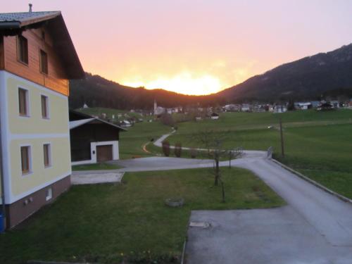 a view of a sunset from a house at Ferienhaus Reiter Lotte in Gosau