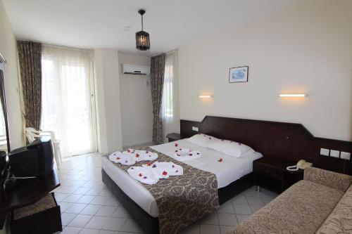 Postel nebo postele na pokoji v ubytování Bariscan Hotel