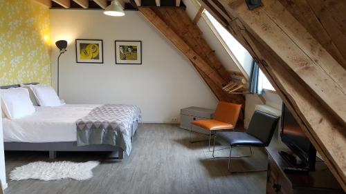Кровать или кровати в номере De Gaanderij