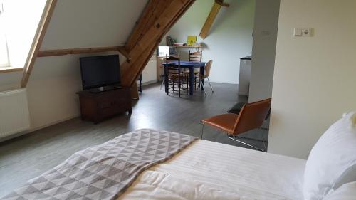 Katil atau katil-katil dalam bilik di De Gaanderij bed and Breakfast