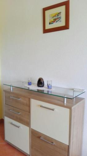 a glass counter top on top of a dresser at Apartment Peris in Sevid