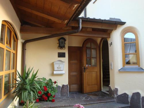 a house with a door and flowers in front of it at Hotel Landgasthof Hirsch in Marktlustenau