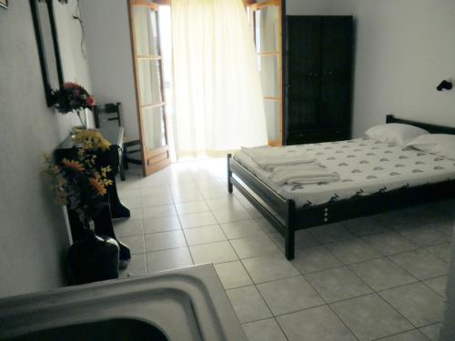 a bedroom with a bed in a room at Mimoza Studios in Skiathos Town