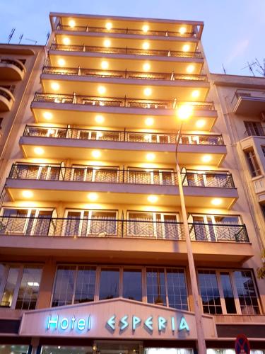 a hotel with lights on the side of a building at Esperia in Thessaloniki