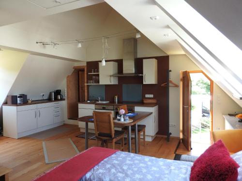 a room with a kitchen and a dining room at Sweet Home Suite in Hallerndorf
