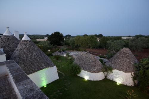 an overhead view of a group of roofs with lights at B&B Tenuta Ranieri in Selva di Fasano