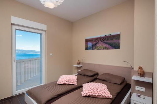 Un pat sau paturi într-o cameră la Villa CaMa