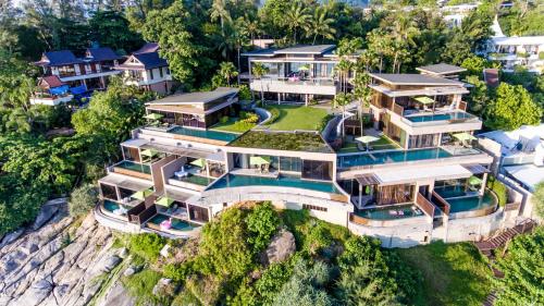 an aerial view of a house on a cliff at Impiana Private Villas Kata Noi in Kata Beach