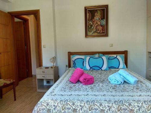 Ένα ή περισσότερα κρεβάτια σε δωμάτιο στο Flamiatos Garden Cottages