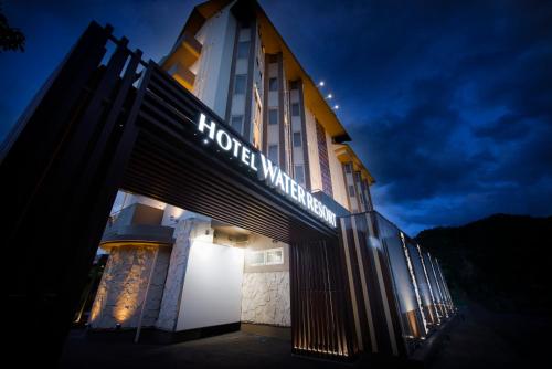 a hotel with a sign on the side of a building at Hotel Water Resort Sendai (Adult Only) in Sendai