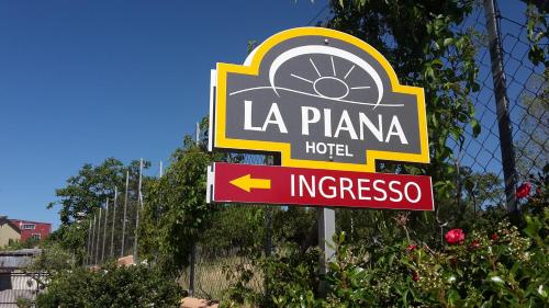 a sign for a la plana hotel at La Piana Hotel in Tito