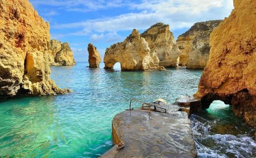 a body of water with rocks in the water at Lagos City Center Guest House & Hostel in Lagos