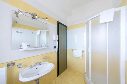 a bathroom with a sink and a shower at La Residenza Aparthotel in Maiori
