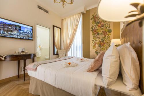 Кровать или кровати в номере Royal Suite Trinità Dei Monti