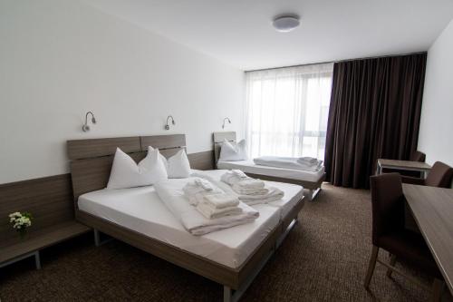 Ліжко або ліжка в номері Lifestyle Hotel Leithana
