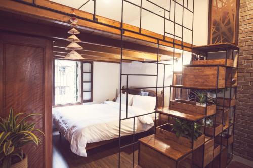 Postel nebo postele na pokoji v ubytování Tuti Tong Dan Homestay
