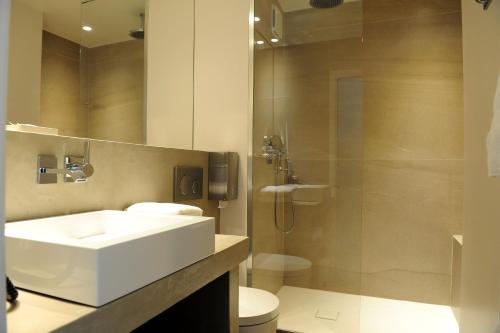 Kylpyhuone majoituspaikassa Hotel & Appartements Gochoki