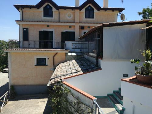 a house with a balcony and a building at Casa Fasano Amalfi Coast in Vietri sul Mare