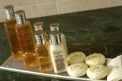 a tray with several bottles of essential oils on it at Hotel Alle Alpi in Moena