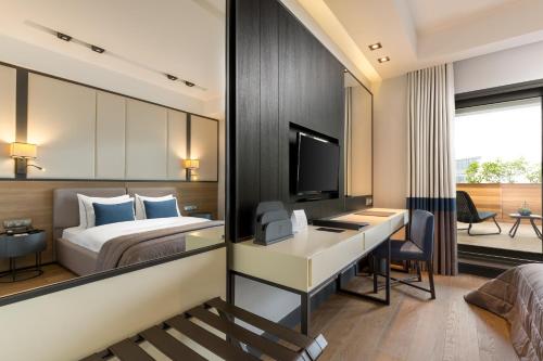 a hotel room with a bed and a desk at The Fortyfive Business Hotel & Spa in Manisa